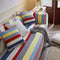 Housse de canapé matelassée à rayures colorées, protection chic, confortable