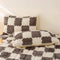 Surmatelas et taie d'oreiller en peluche à damier chaud
